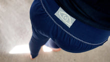 Load image into Gallery viewer, waistband detail with cross stitch, stitched by hand, herringbone stitch, ornament stitch, blue organic cotton jersey, eye logo by icancu